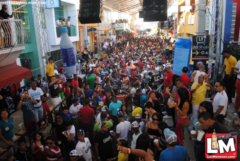 a crowd of people gathered in front of a building