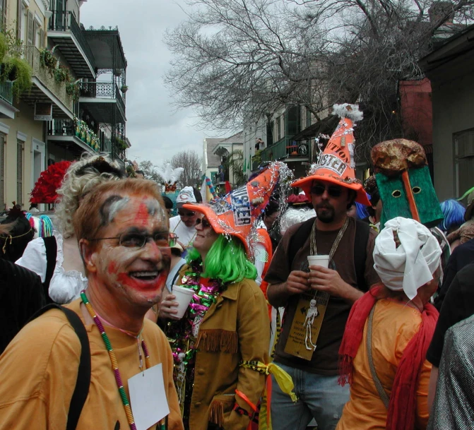 several people dressed as clowns are walking down the street