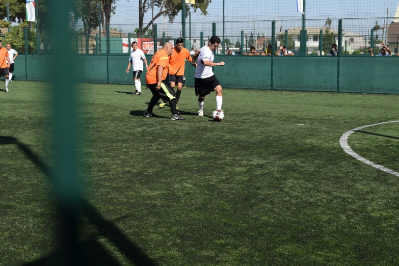 two teams of soccer players during a game on the field