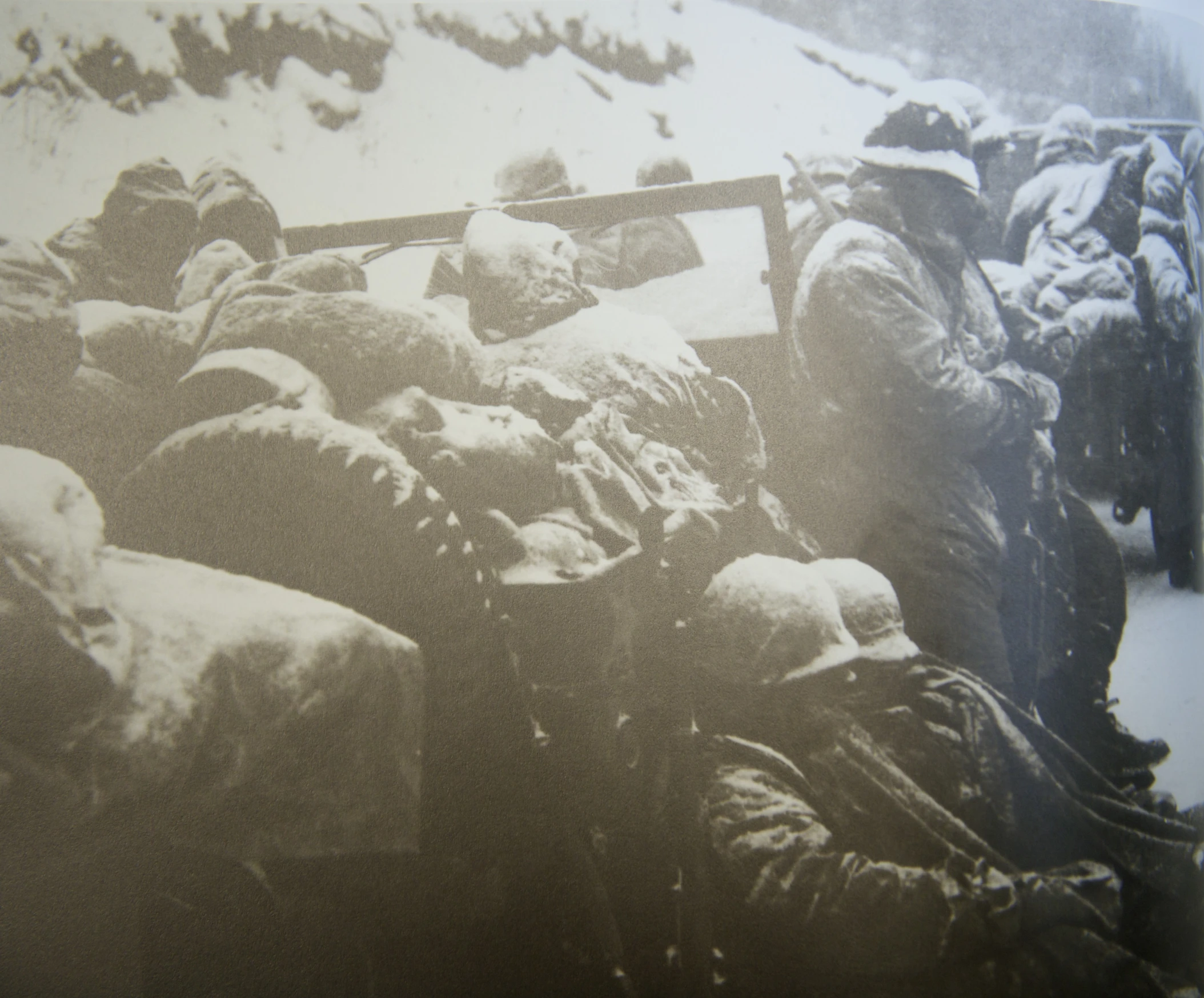 some soldiers are kneeling in the snow