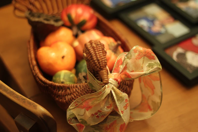 baskets of apples and other vegetables are displayed on a table