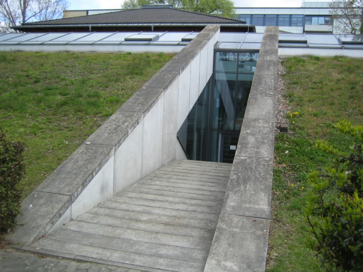 a concrete staircase leads up to a building