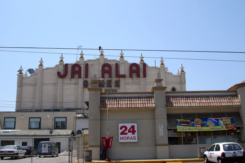 a large building with a sign that says ajalai in large letters on it