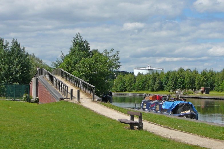 some people are standing near a dock on a boat