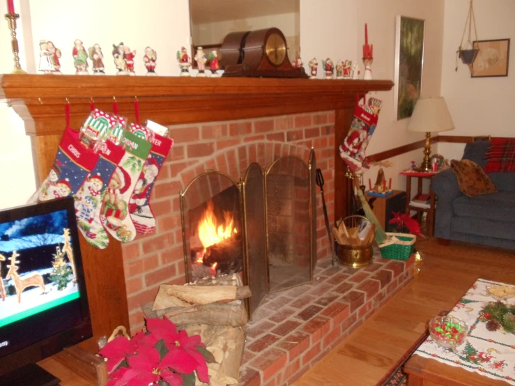 this is an image of a fireplace decorated for christmas