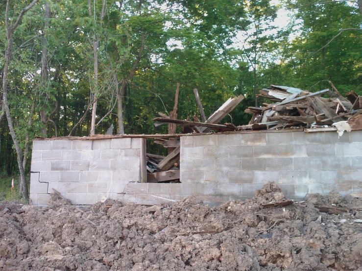 a dilapidated outbuilding with broken windows and junk