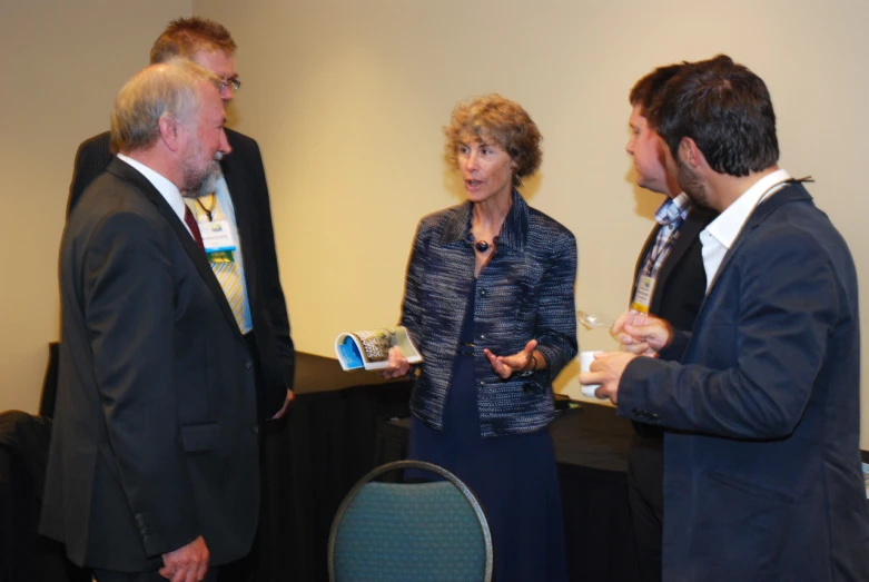 four men and a woman are having some discussion