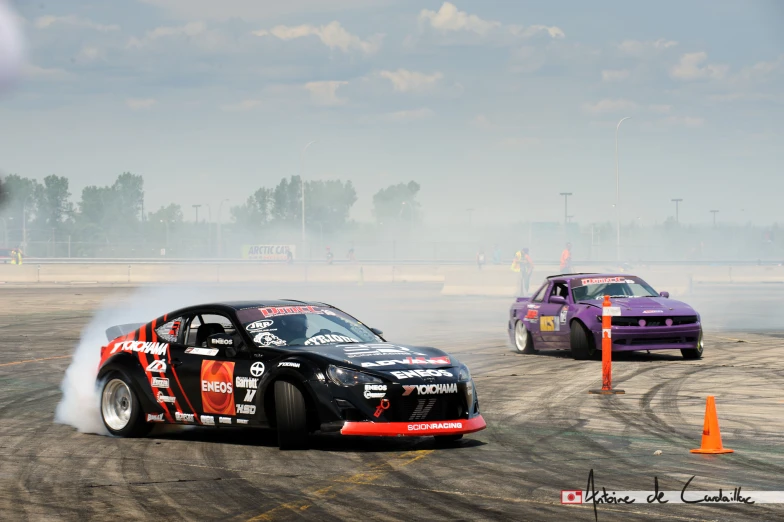 two cars racing on the track during a race