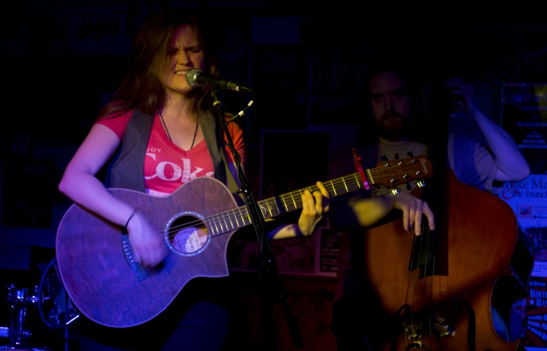 two people in a room with musical instruments