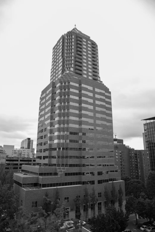 the building in black and white is being constructed