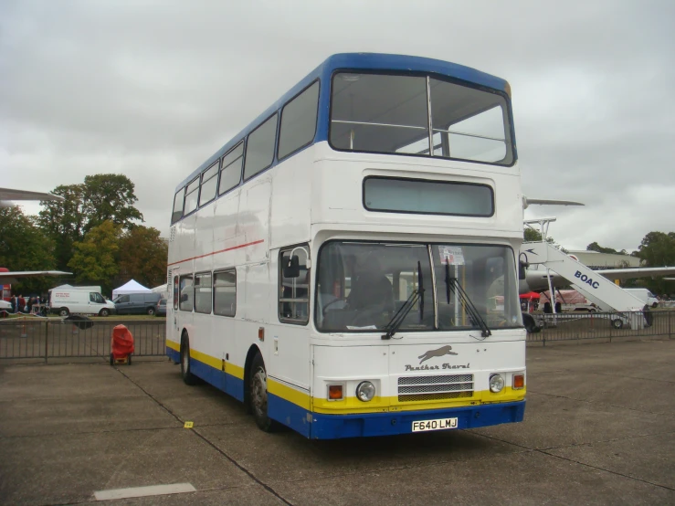 a double decker bus is parked on the lot