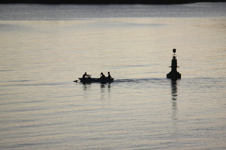 people out on a small boat in the middle of a lake