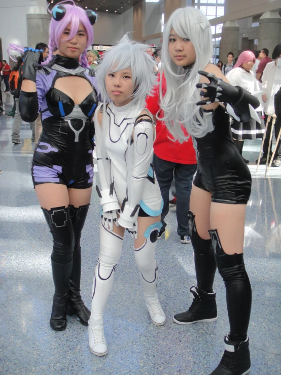 two girls are in costumes while standing around