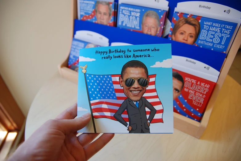 a card with president obama showing the first lady to be featured