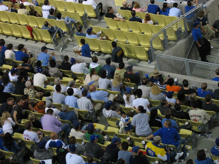 a group of people at the stands sitting on chairs