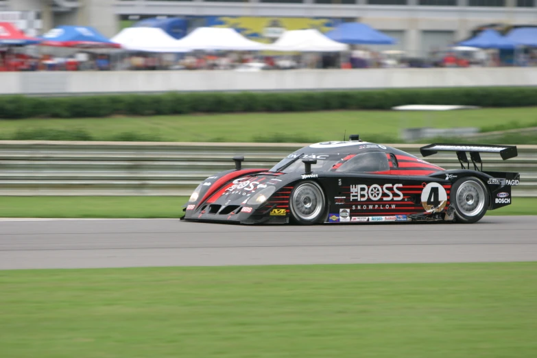 the car is driving through the curve of the track