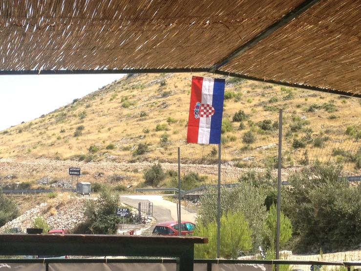 a flag that is flying on a pole outside