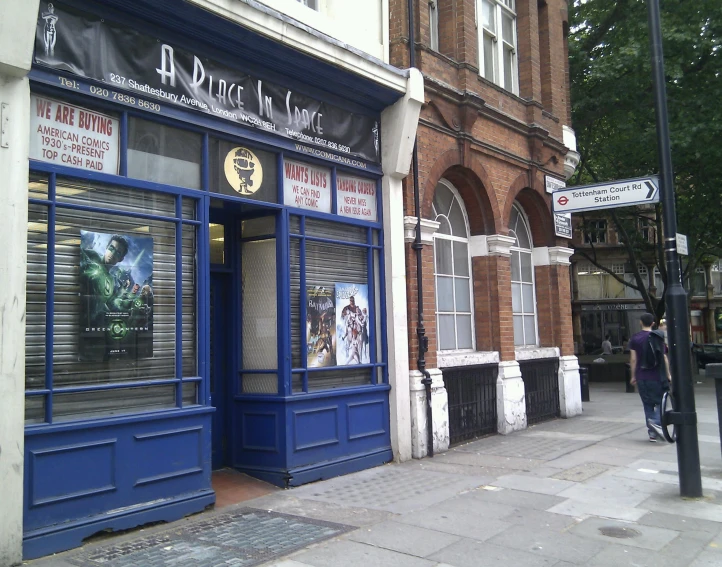 there is a storefront with different windows and signs