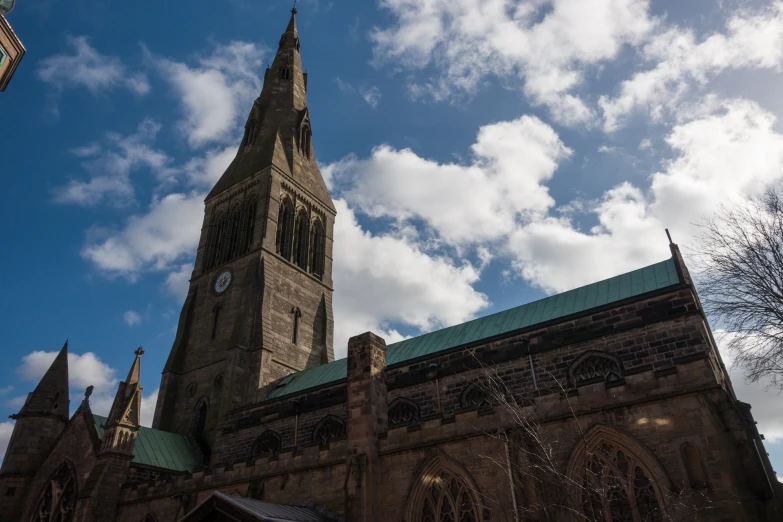 a church with towers and a blue sky behind it