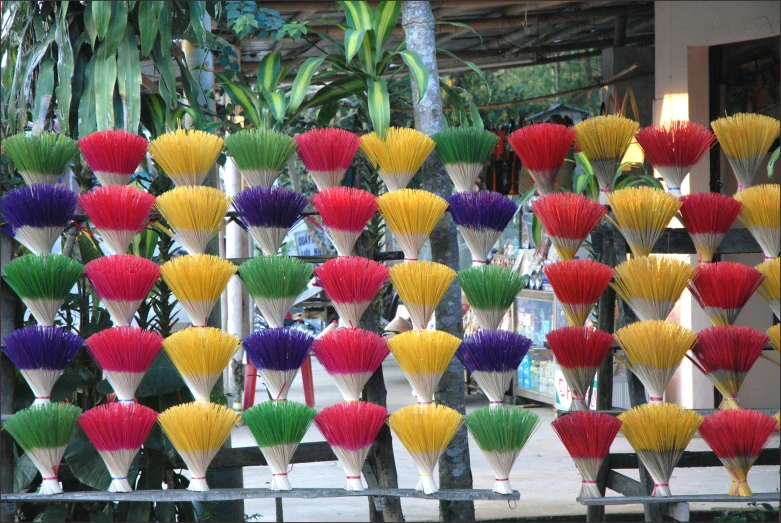 many colored fan shaped objects are arranged outside