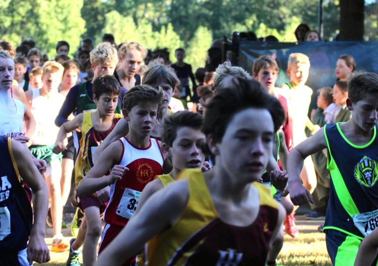 a group of boys running during a race