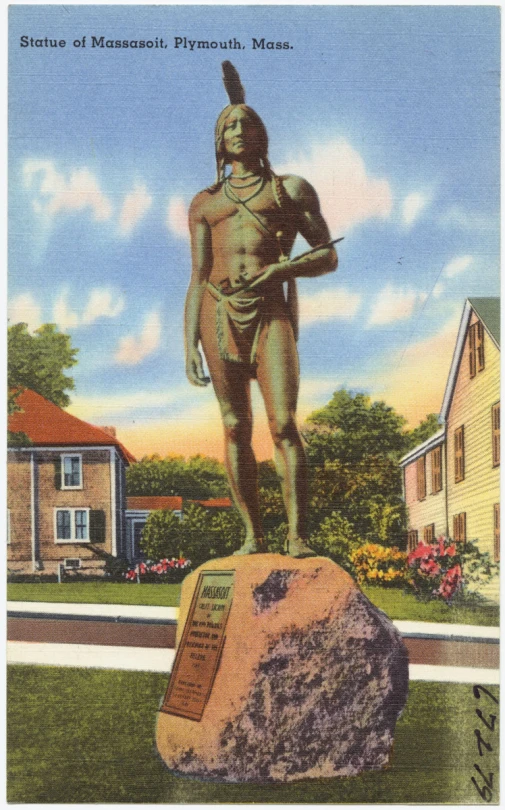 a sculpture of a native american is in front of a house