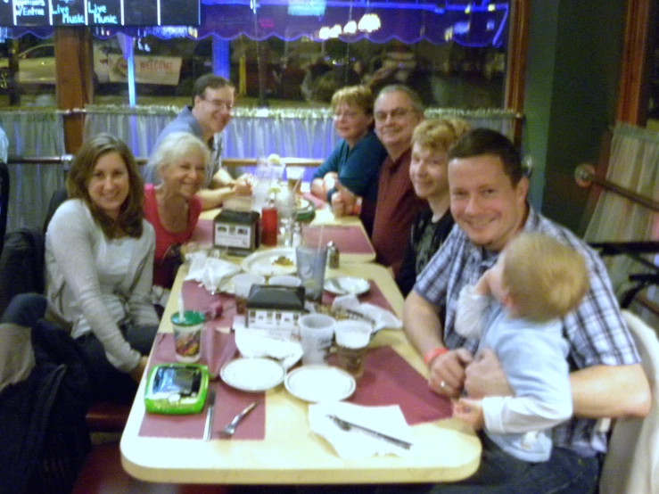 the family is enjoying their dinner together