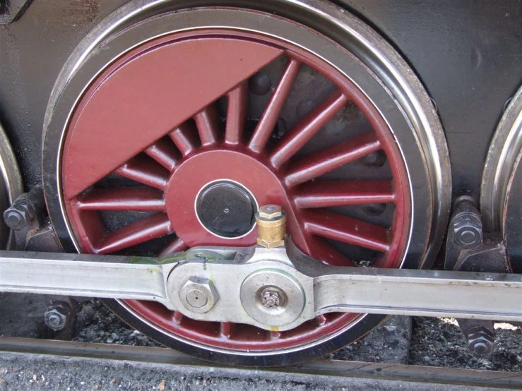 the front end of a train has metal wheels on it