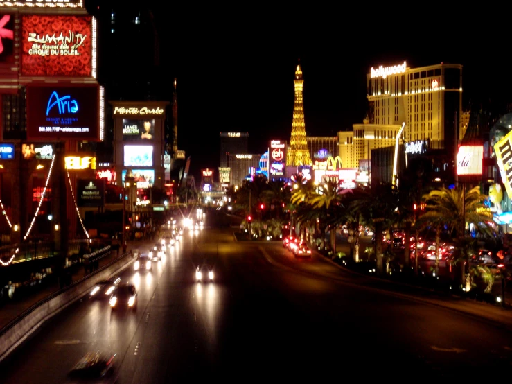 a busy street in the middle of a major city at night