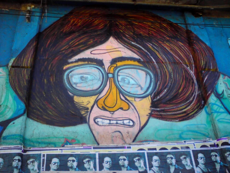 a large painting of a woman with glasses and a man's hair, in various ways