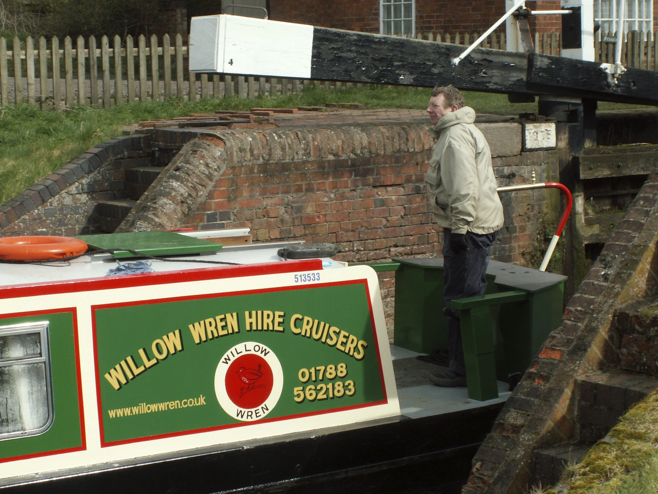 a man is standing on the edge of a boat