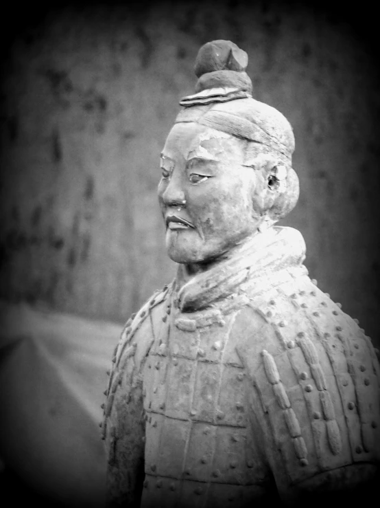 a statue is placed in front of a building