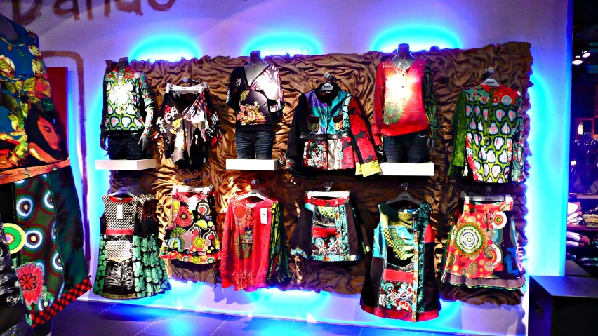 the clothing display is filled with many items