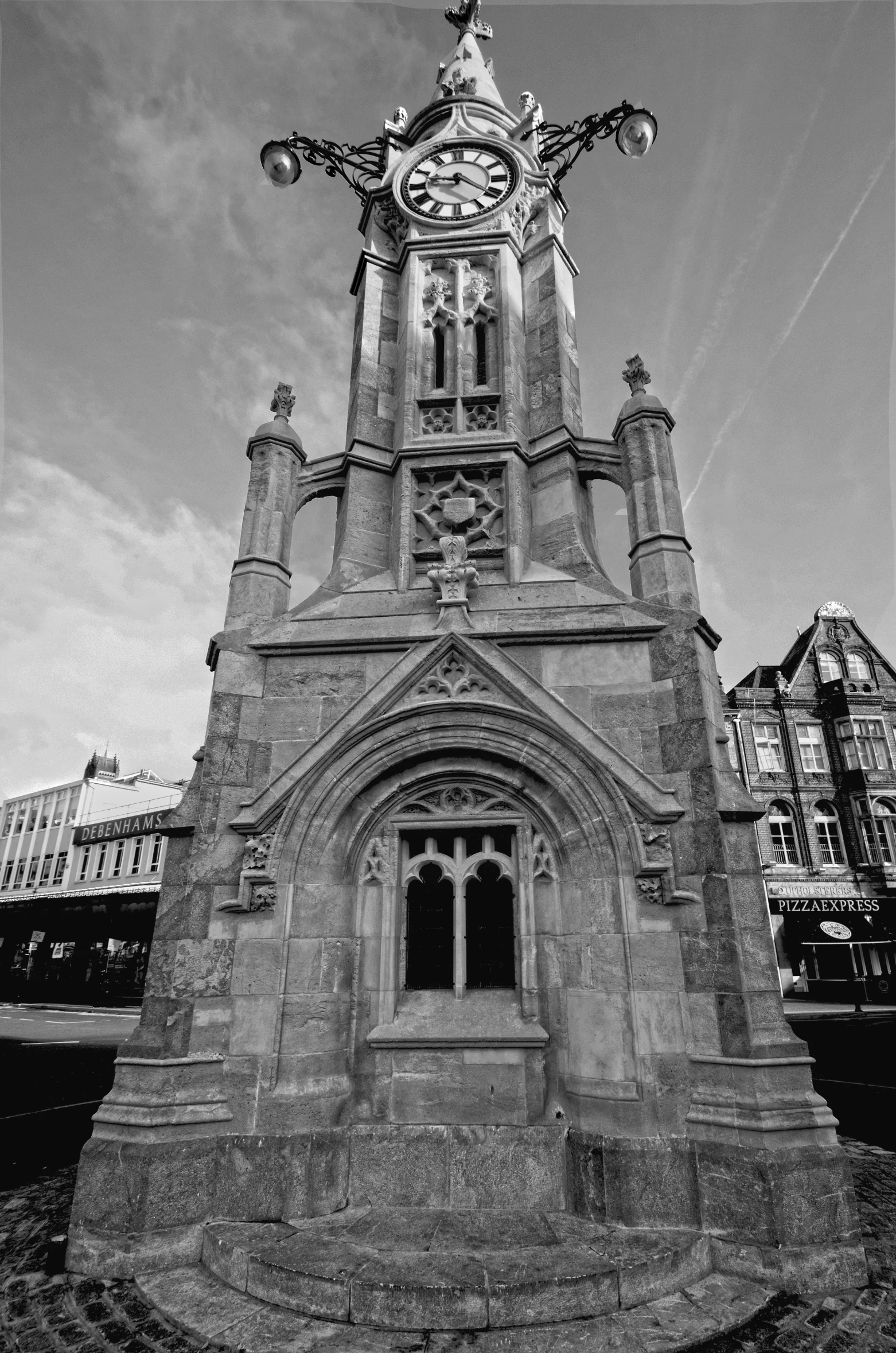 an old clock tower near a tall building