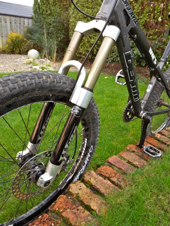 a bike that is sitting on the side of a stone wall