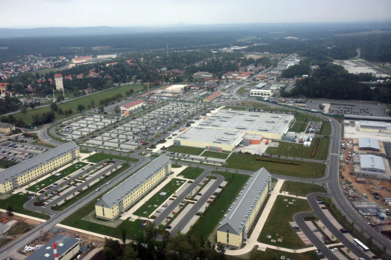 the parking lot of a building complex with many other large buildings