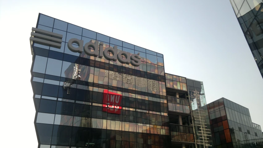 an eibocos sign is reflected on the windows of a building