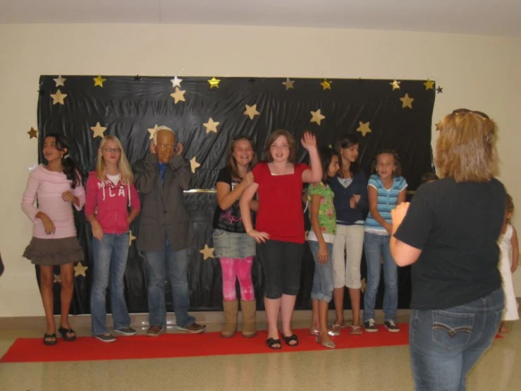 a group of people standing on top of a stage