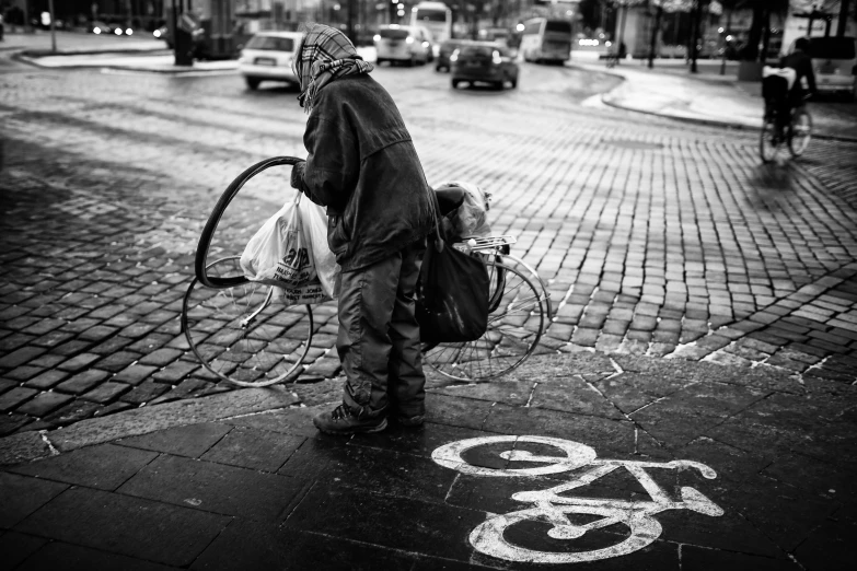 a man riding a bike down a city street