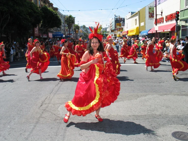 a woman dancing in front of a crowd