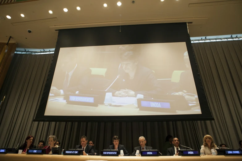 people are sitting around a table during a meeting