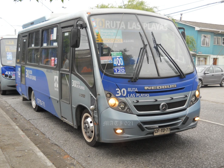 the bus is parked on the side of the street