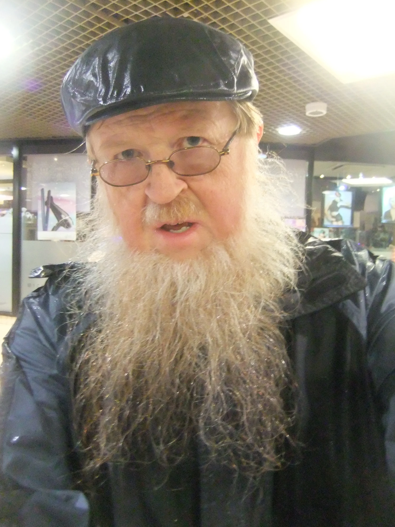 an old man wearing a hat and glasses