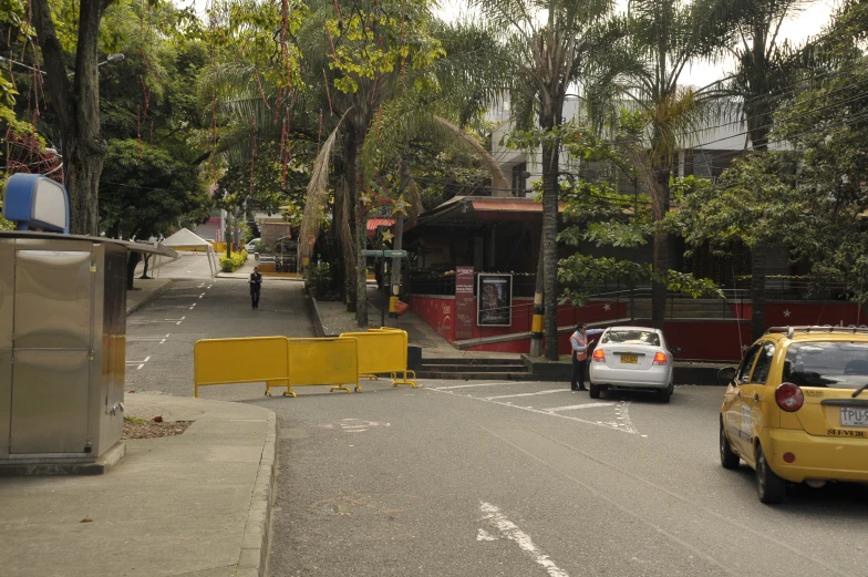 a bus stop and a van passing down the street