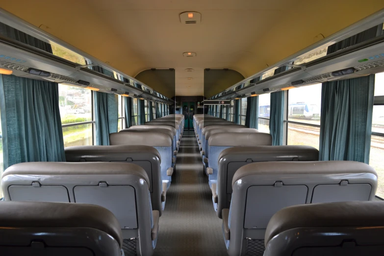 the seats on this passenger train are empty