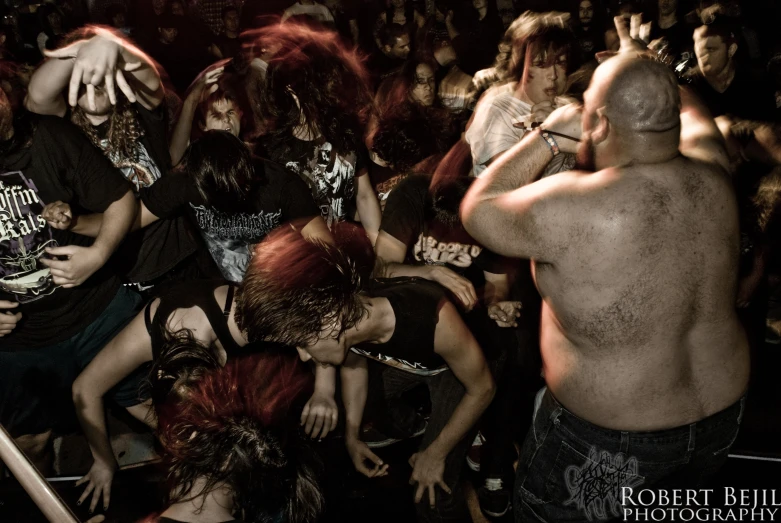 a group of people sitting together and dancing