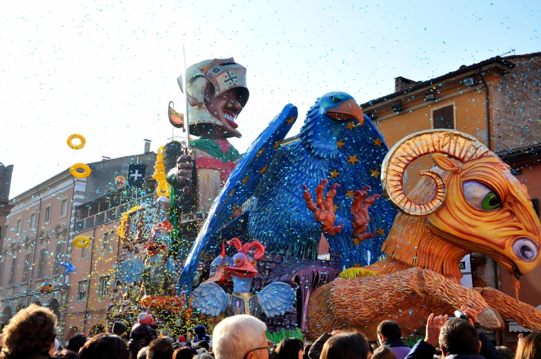 a large group of people standing around float at an event