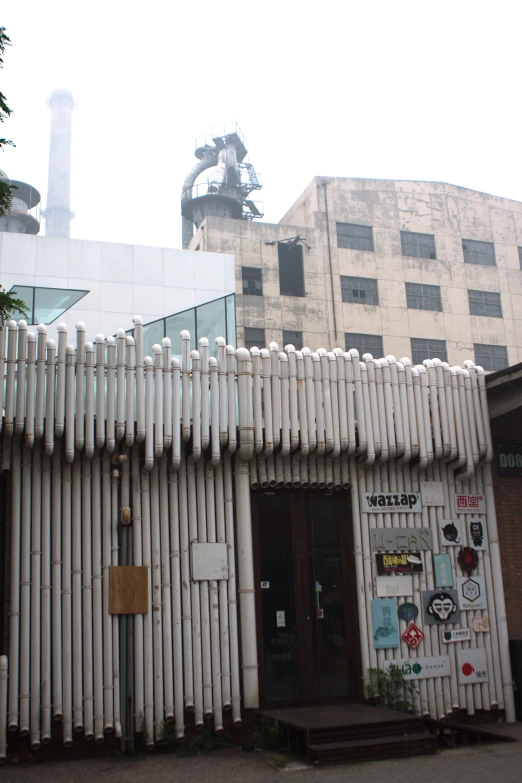 a tall building with a large white fence on the front