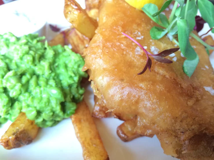 a plate of food including chicken and green vegetables