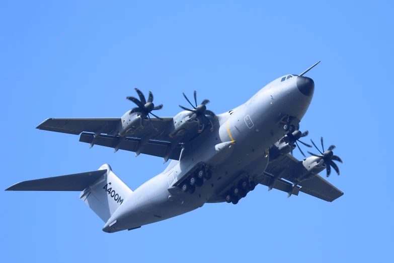 a large jet is flying in the blue sky